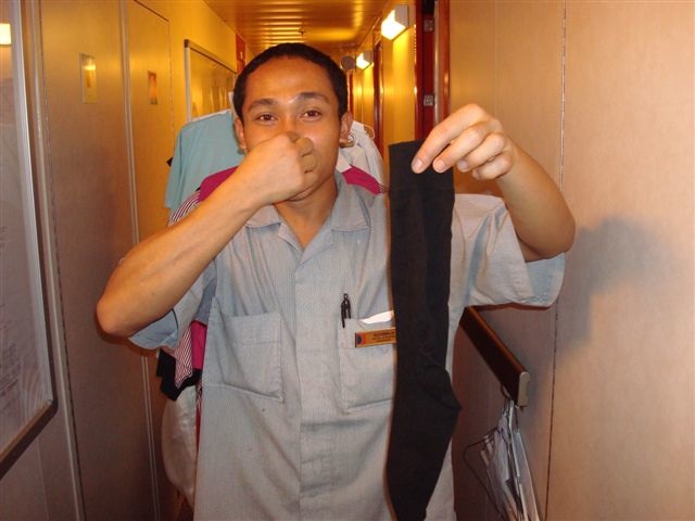 our-cabin-steward-sudarmaja-with-johns-smelly-socks.jpg
